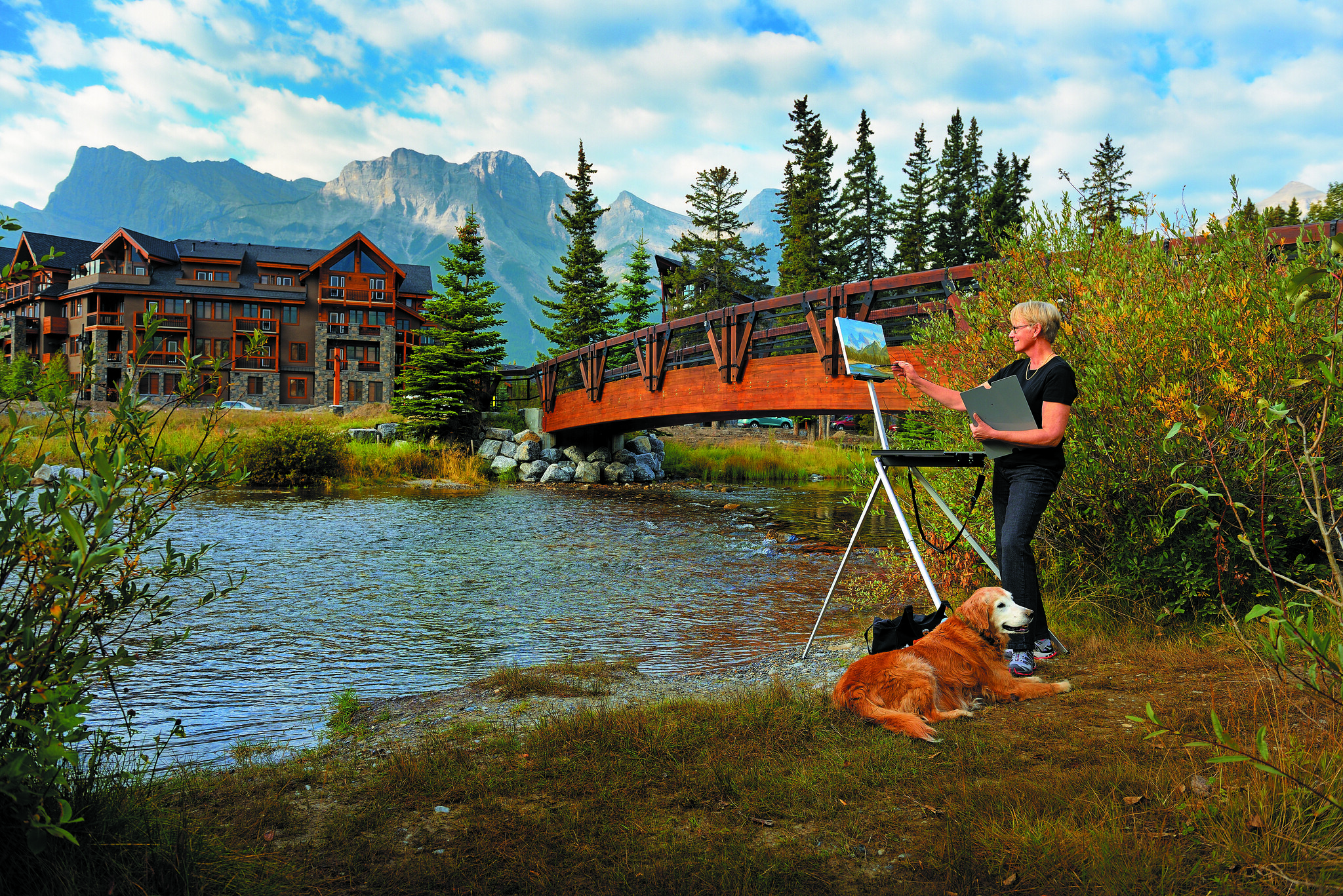 Resident painting nature scenery outdoors at Origin at Spring Creek